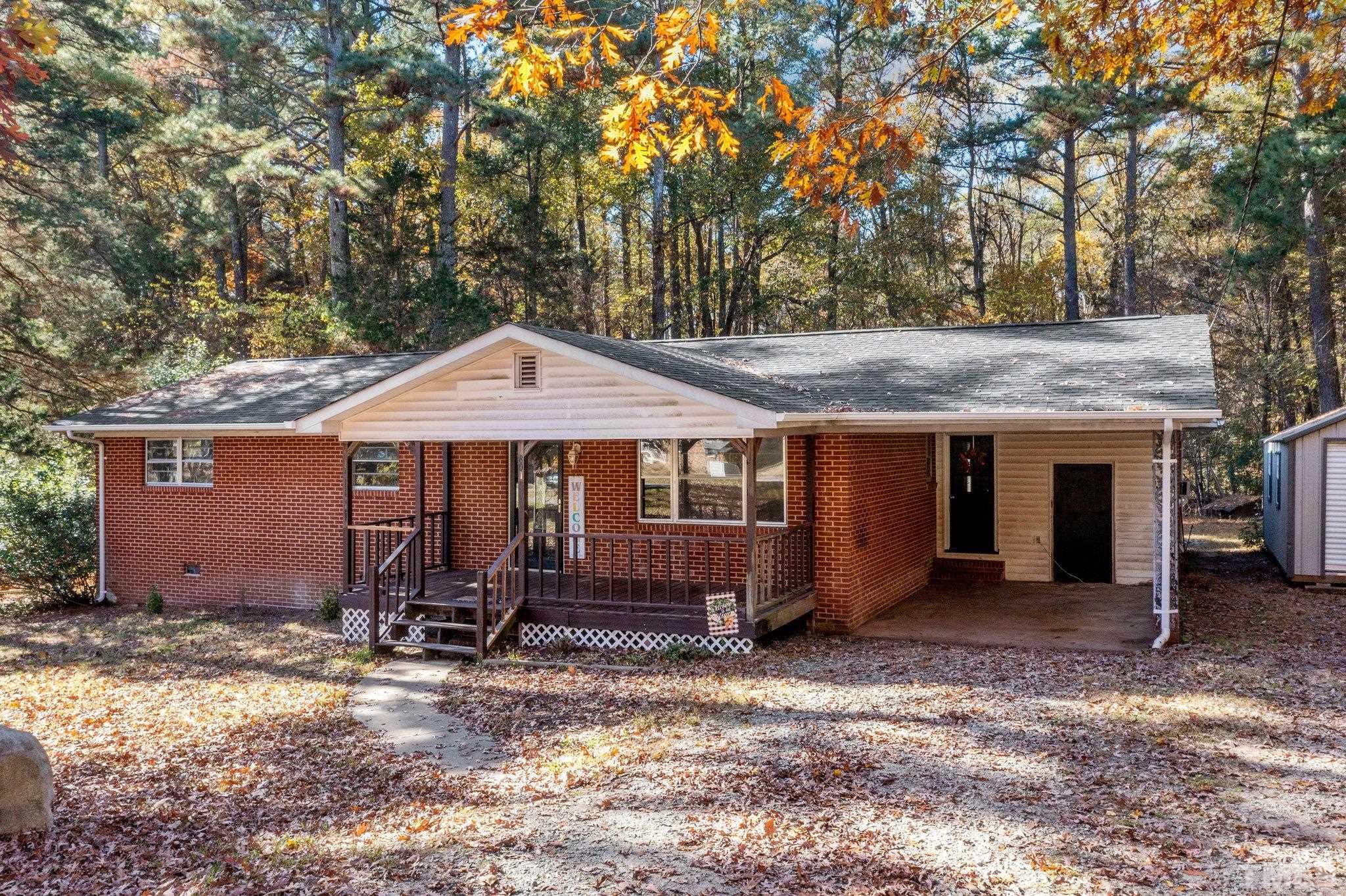 801 Avalon Road Durham, NC 27704 - Photo 2 of 30 a front view of a house with a yard and garage