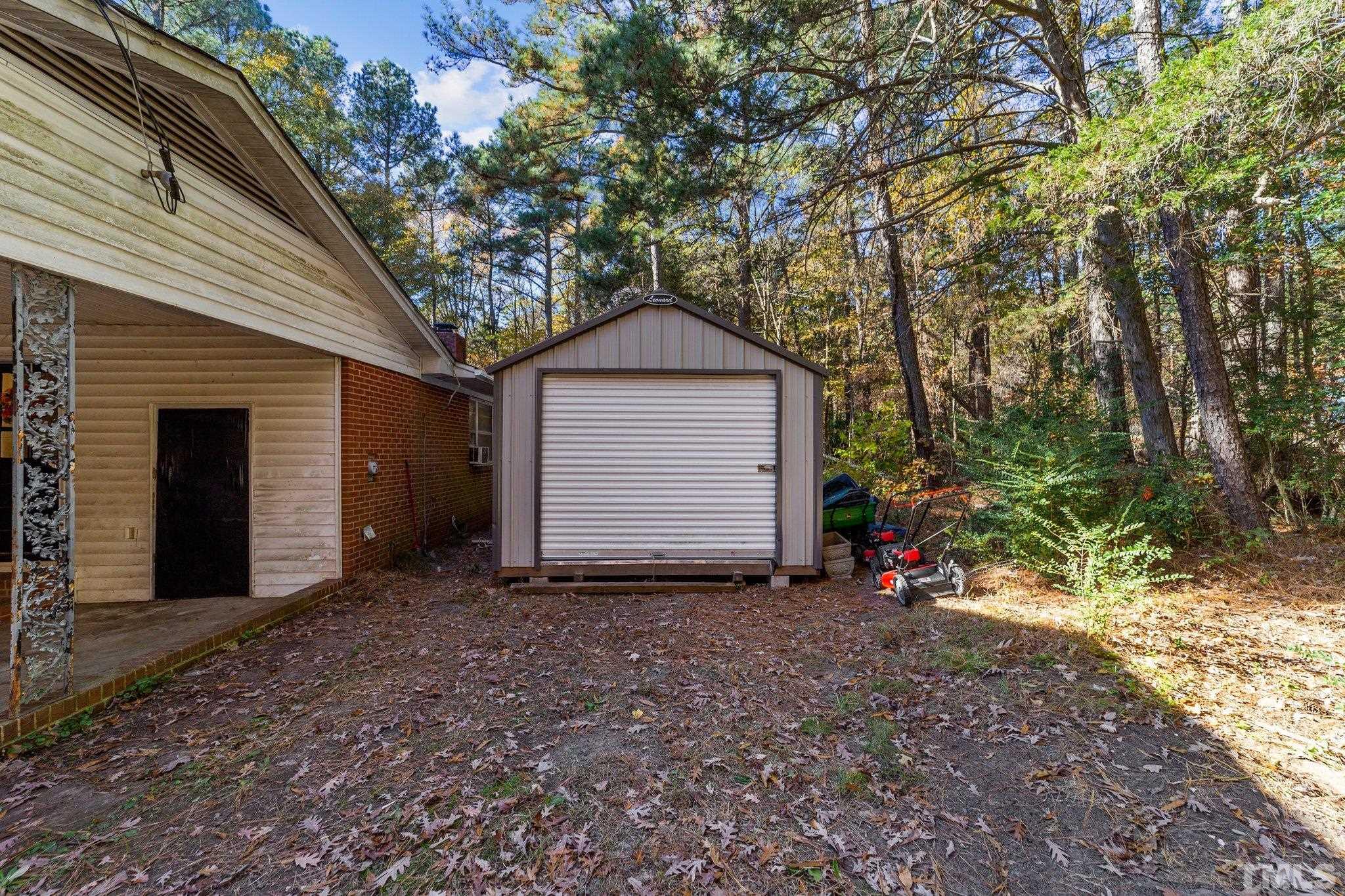 801 Avalon Road Durham, NC 27704 - Photo 11 of 30 a front view of a house with a yard and garage
