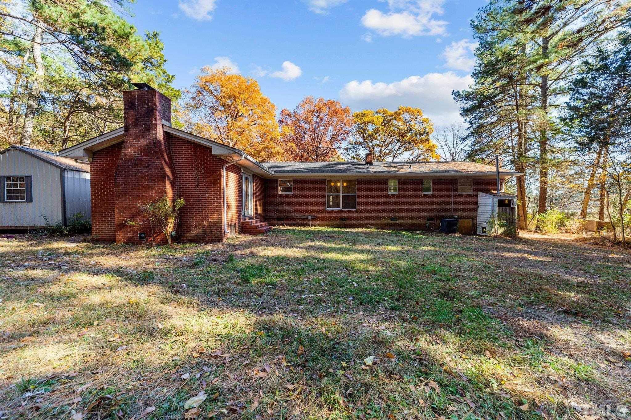 801 Avalon Road Durham, NC 27704 - Photo 13 of 30 a view of a house with a yard and a tree