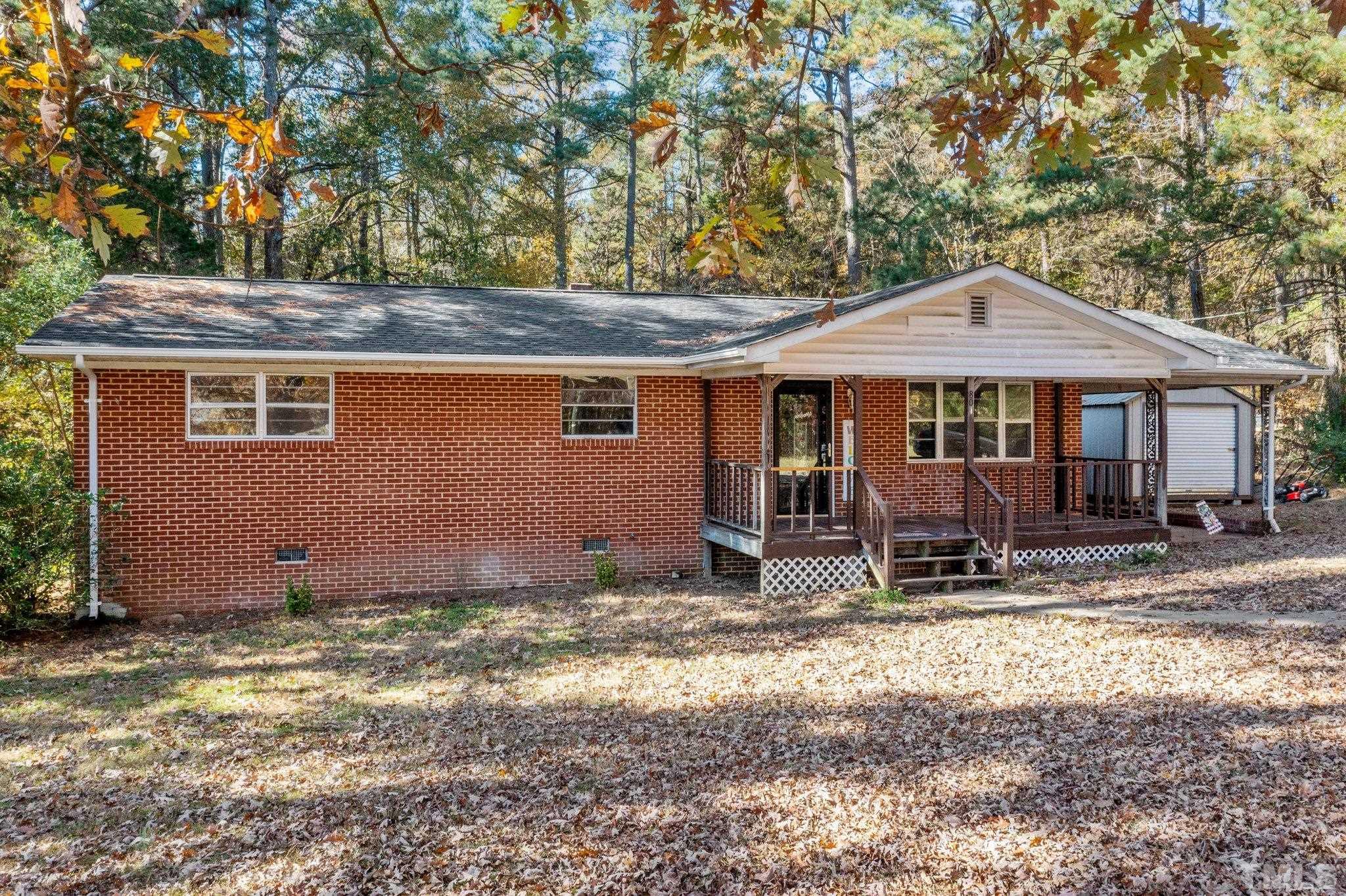 801 Avalon Road Durham, NC 27704 - Photo 3 of 30 a house with trees in the background