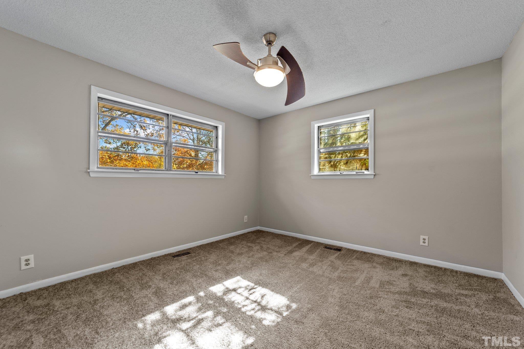 801 Avalon Road Durham, NC 27704 - Photo 25 of 30 a view of room with window and ceiling fan