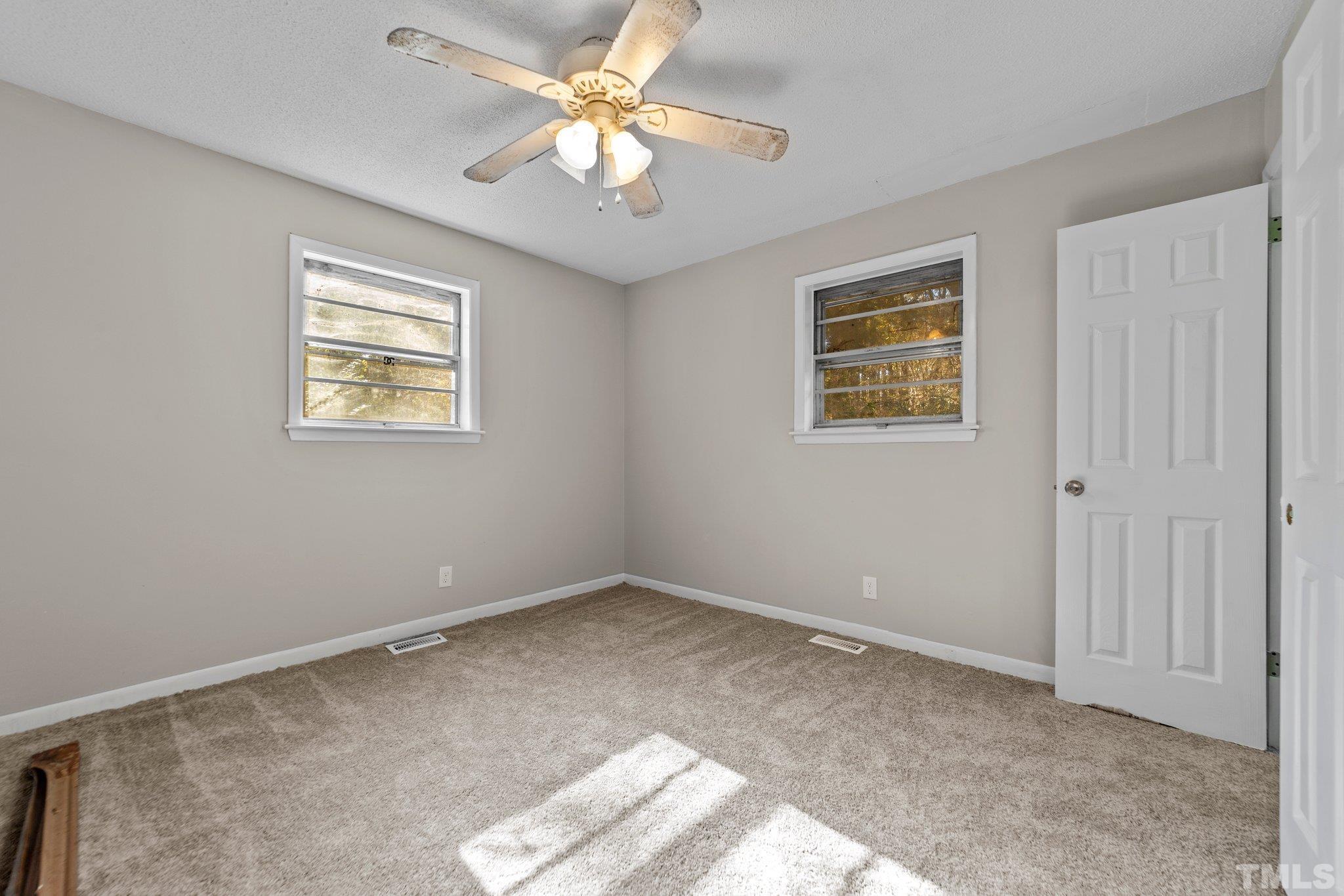 801 Avalon Road Durham, NC 27704 - Photo 27 of 30 a view of an empty room with a window