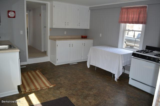 2793 State Road Richmond, MA 01254 - Photo 2 of 20 a kitchen with a sink stove and cabinets