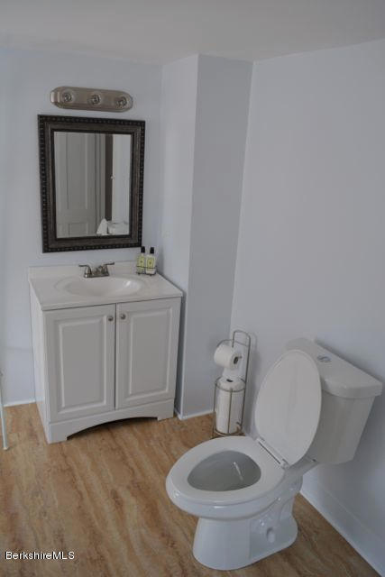 2793 State Road Richmond, MA 01254 - Photo 6 of 20 a bathroom with a toilet a sink and mirror