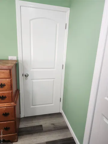 a view of front door with wooden floor