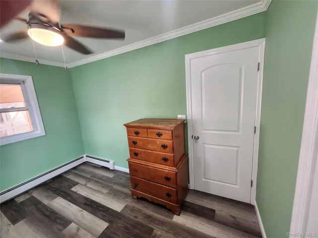 a view of room with window and cabinet