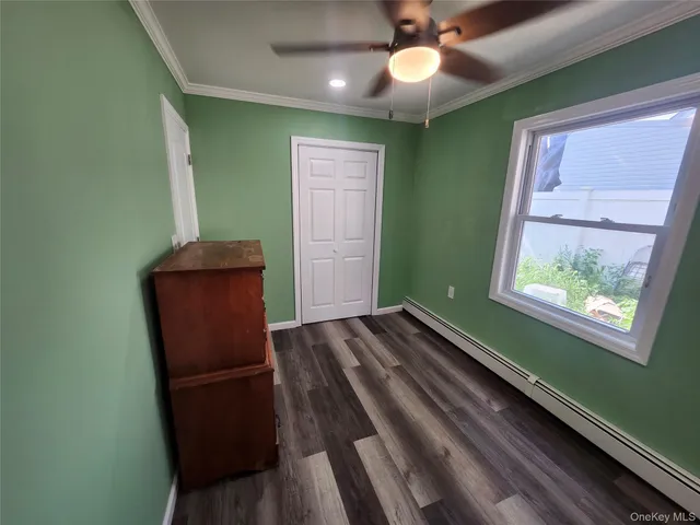 a view of room with window and hallway