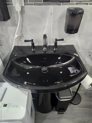 a bathroom with a sink and a mirror