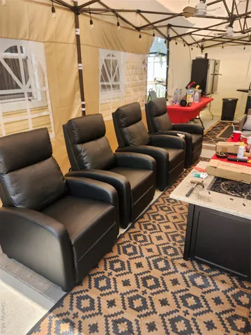 an empty room with wooden floor dryer and windows