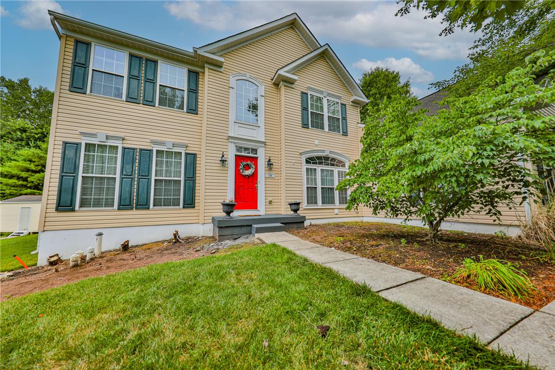 138 Clover Hollow Road Easton, PA 18045 - Photo 1 of 95 A welcoming front entry with a vibrant red door and classic shutters enhance this home's inviting facade.
