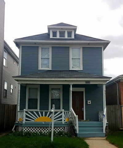 3531 West 65th Street Chicago, IL 60629 - Photo 1 of 25 a front view of a house with a garden