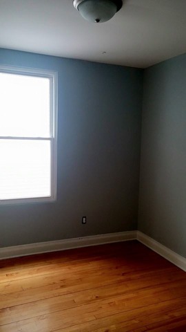 3531 West 65th Street Chicago, IL 60629 - Photo 17 of 25 a view of a room with wooden floor and a window