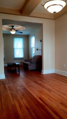 3531 West 65th Street Chicago, IL 60629 - Photo 8 of 25 a living room with hard wood floors and a wooden floor