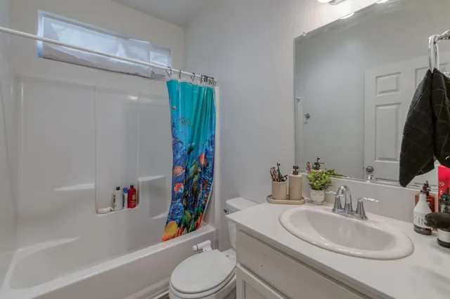 a bathroom with a sink toilet and a bathtub