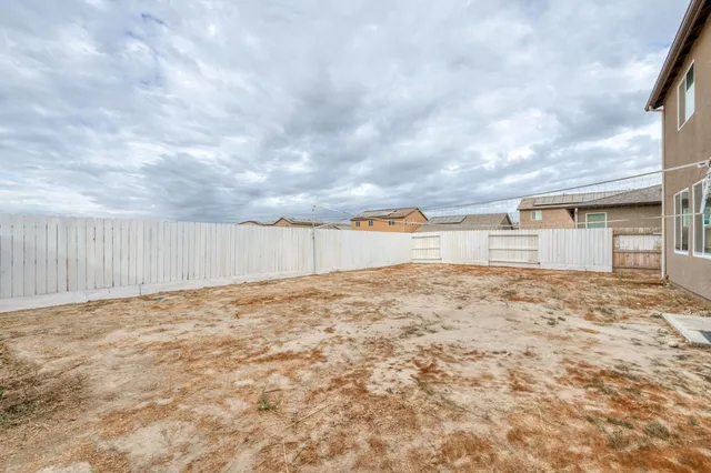 a view of a backyard of the house