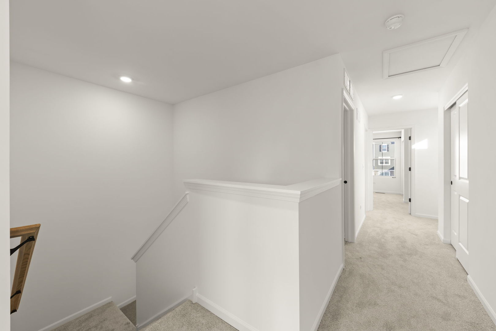 4486 Chelsea Mnr Circle Aurora, IL 60504 - Photo 13 of 23 a view of a hallway with wooden floor