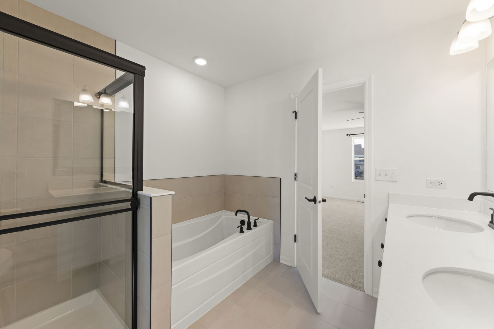 4486 Chelsea Mnr Circle Aurora, IL 60504 - Photo 17 of 23 a bathroom with a bathtub and a shower