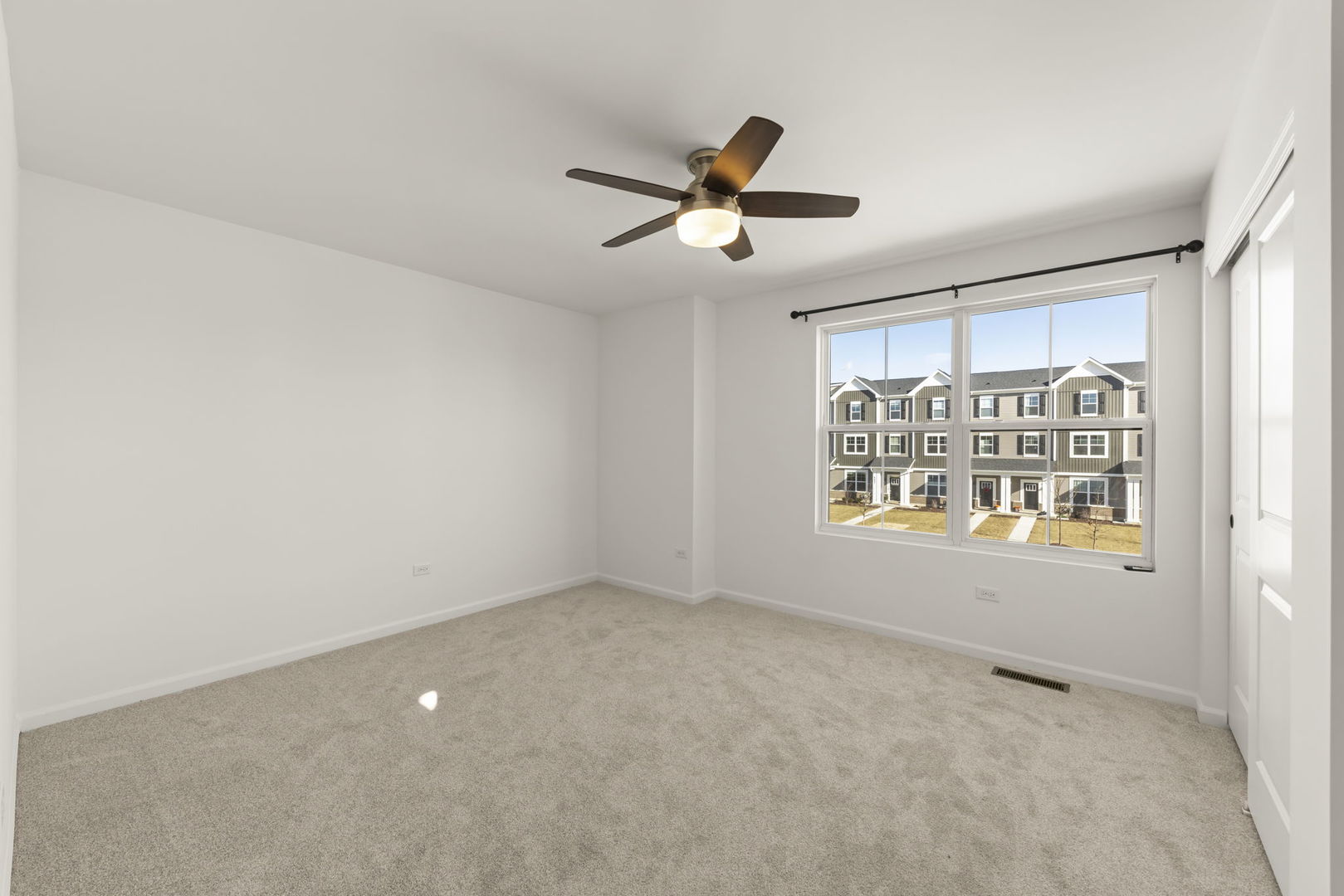 4486 Chelsea Mnr Circle Aurora, IL 60504 - Photo 19 of 23 a view of an empty room with a window