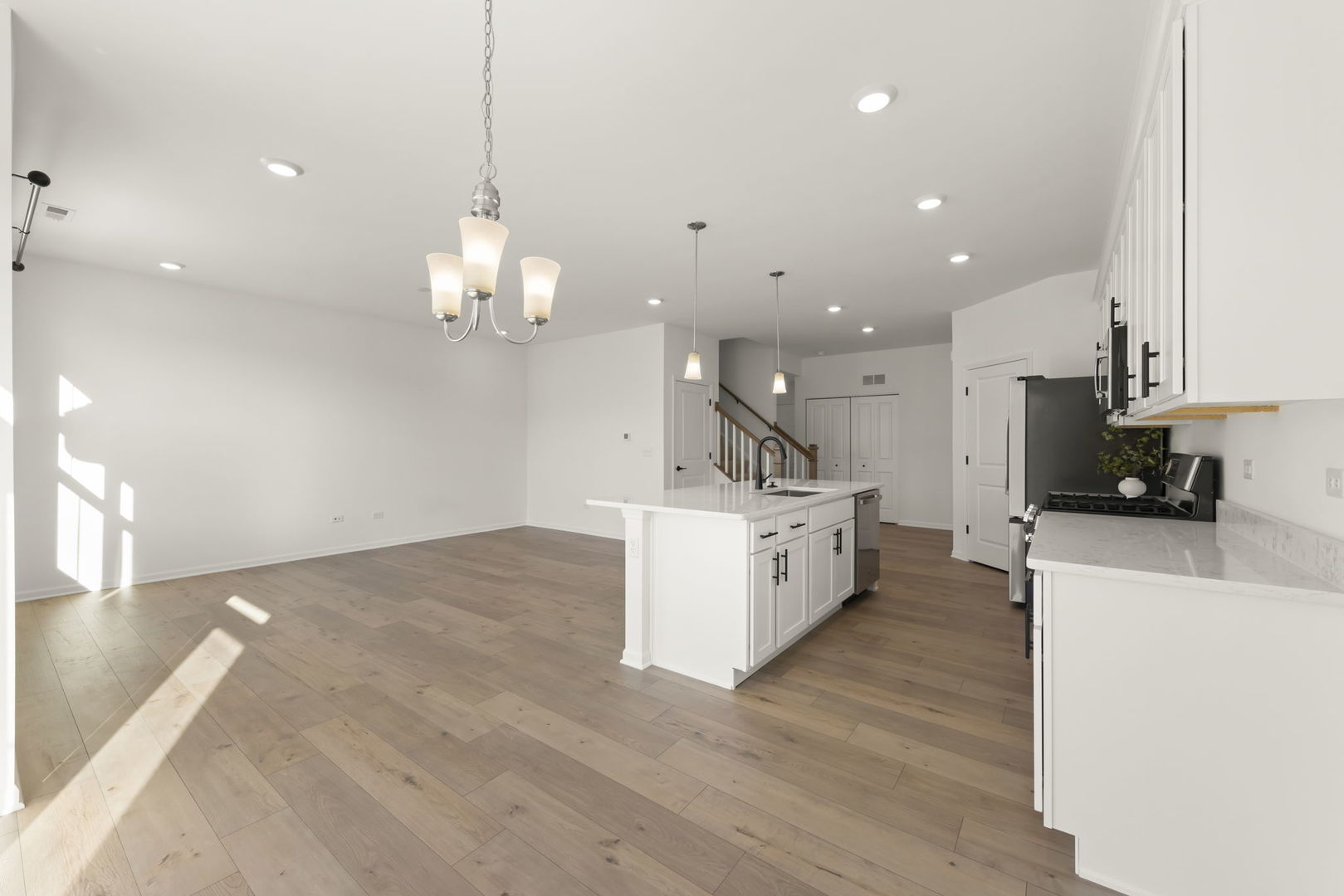4486 Chelsea Mnr Circle Aurora, IL 60504 - Photo 9 of 23 a large kitchen with kitchen island a island a sink stainless steel appliances and cabinets