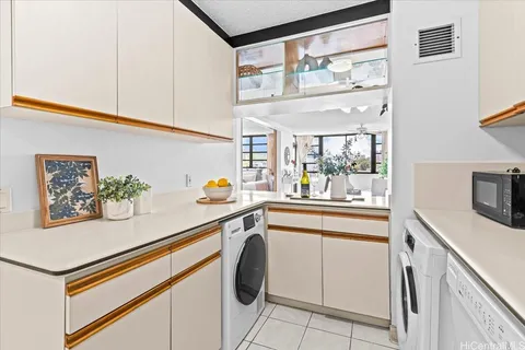 a kitchen with stainless steel appliances a sink and cabinets