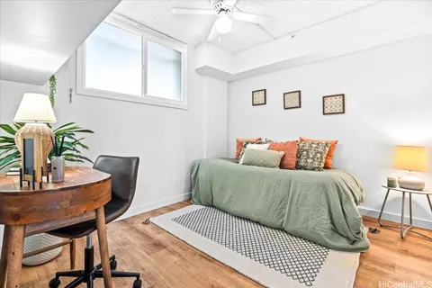 a bedroom with a bed and a table