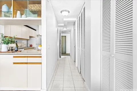 a view of a kitchen from the hallway
