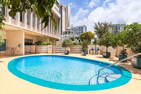 a view of a swimming pool with a yard