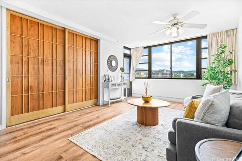 a living room with furniture and a large window