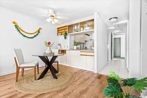 a workspace room with furniture and a chandelier