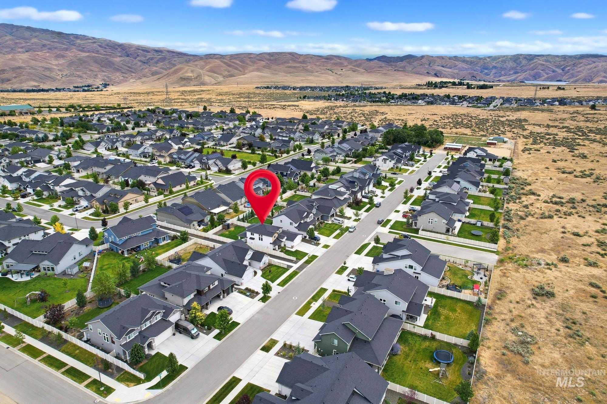 5676 East Zaffre Ridge Street Boise, ID 83716 - Photo 50 of 50 Residential neighborhood with modern homes, asphalt streets, and sidewalks