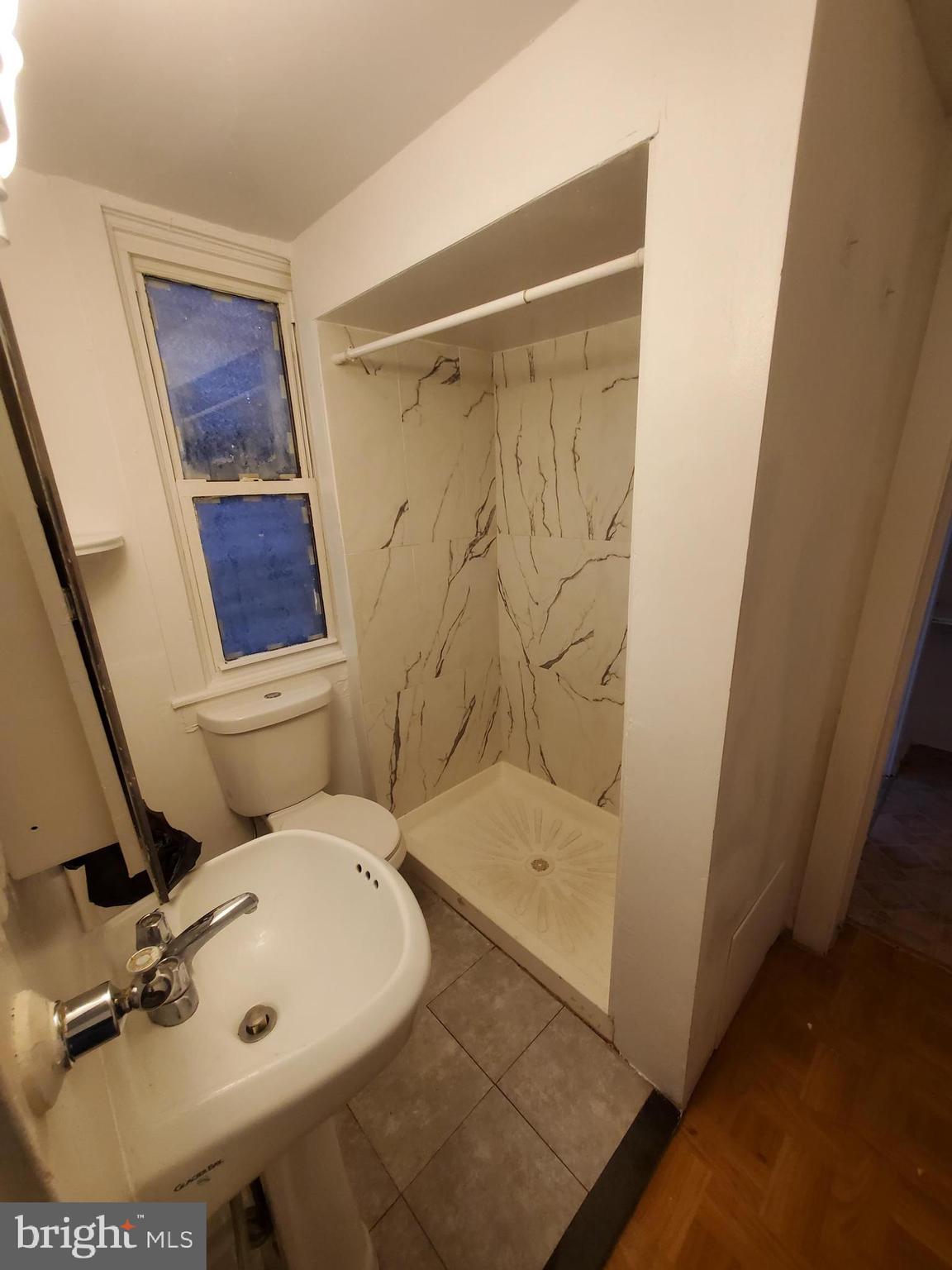 315 North 6th Street, Unit 1 Reading, PA 19601 - Photo 8 of 9 a bathroom with a toilet and a shower