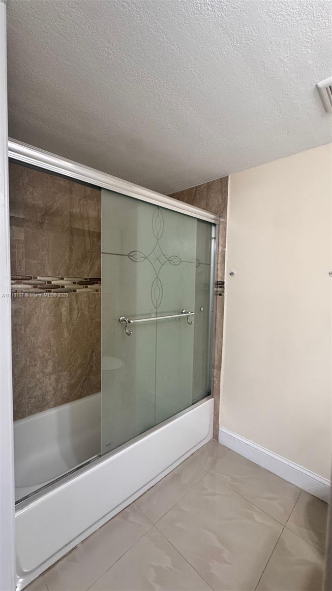 15610 Southwest 80th Street, Unit J104 Miami, FL 33193 - Photo 11 of 16 a bathroom with a bathtub
