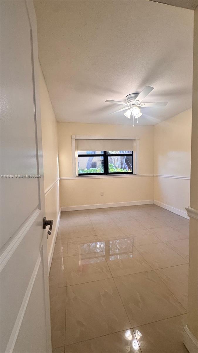 15610 Southwest 80th Street, Unit J104 Miami, FL 33193 - Photo 12 of 16 a view of a big room with closet and windows