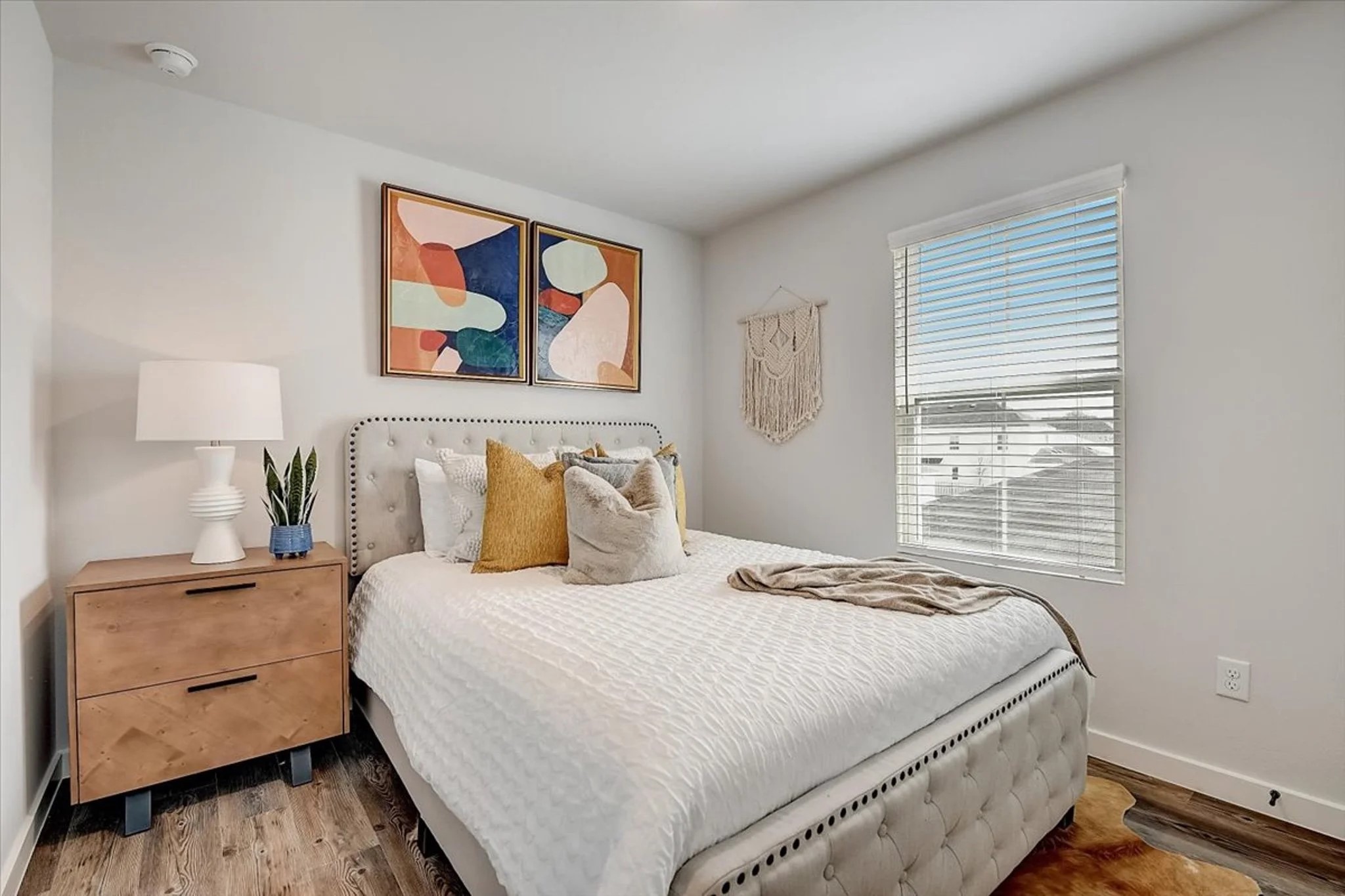 15101 Litsey Crk Drive, Unit 15259H Roanoke, TX 76262 - Photo 3 of 20 a bedroom with a bed and a dresser next to a window