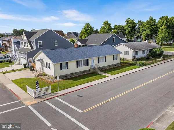 an aerial view of a house with a yard and potted plants