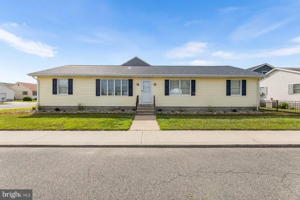 a view of front a house with a yard