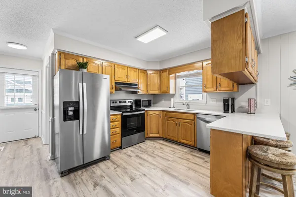 a spacious bedroom with a bed and a chandelier