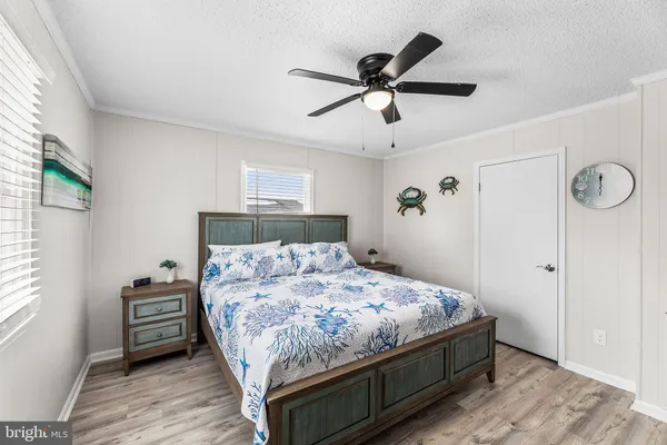 a bedroom with a bed and wall painting