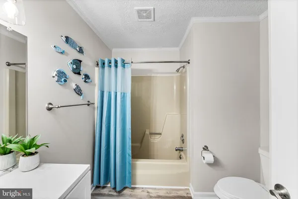 a bathroom with a sink vanity and mirror