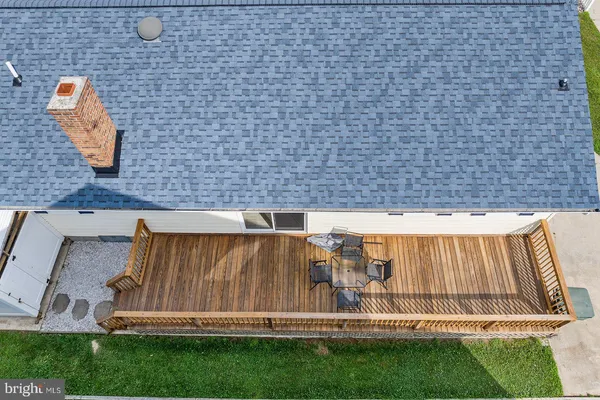 an aerial view of residential houses with outdoor space and street view