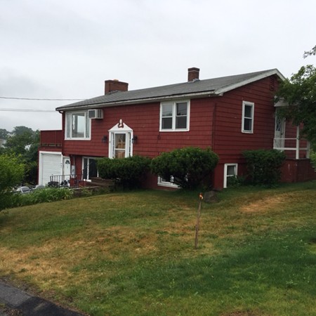a front view of a house with a yard