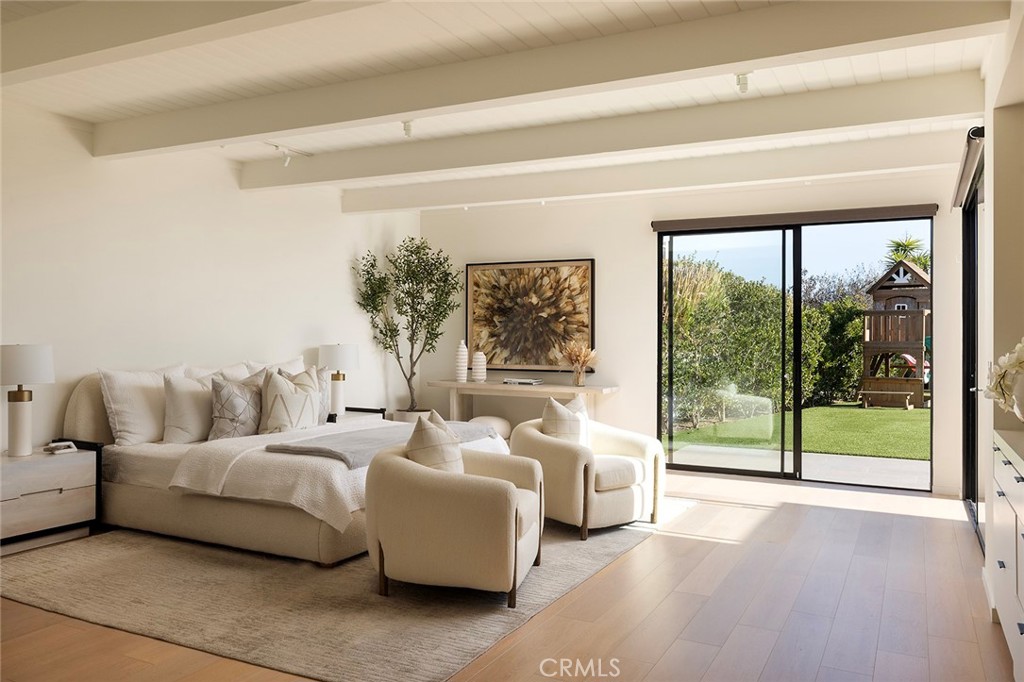 32602 Crete Road Dana Point, CA 92629 - Photo 14 of 41 Large Primary suit with built ins, wood flooring and walk in closet with custom built ins.