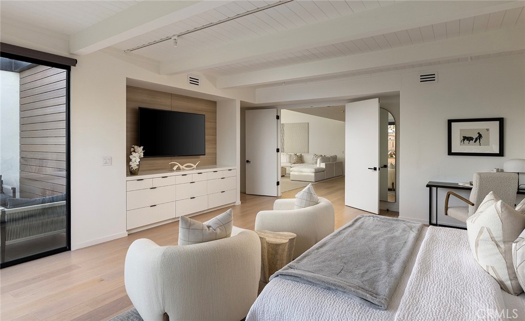 32602 Crete Road Dana Point, CA 92629 - Photo 16 of 41 Large Primary suit with built ins, wood flooring and walk in closet with custom built ins.