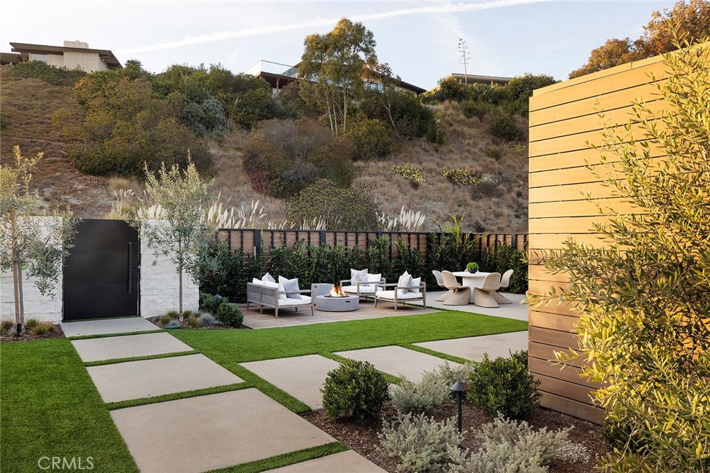 32602 Crete Road Dana Point, CA 92629 - Photo 33 of 41 Large yard with artificial turf, professionally landscaped with lighting perfect for entertaining and those priceless family BBQ's, area has a Gas Fire pit and built in BBQ area