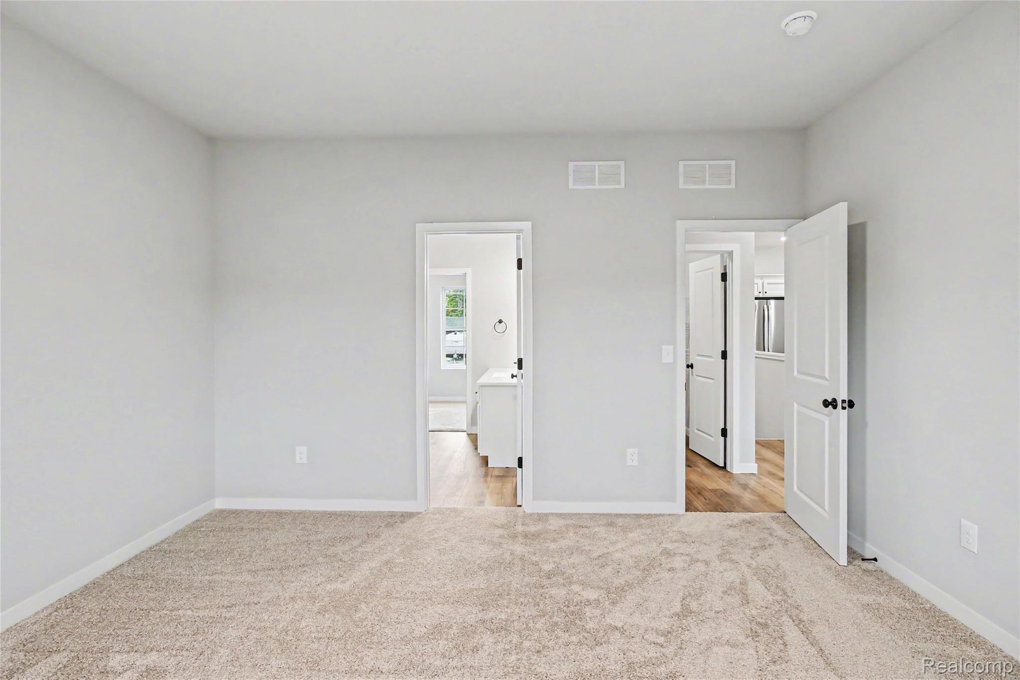 1210 Lockes Street Howell, MI 48843 - Photo 9 of 37 The primary suite is located on the upper level and includes a private bath and oversized walk-in closet with large window for natural lighting.