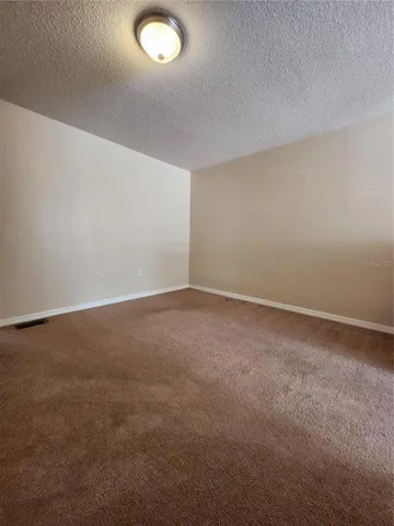 an empty room with a empty space and a window