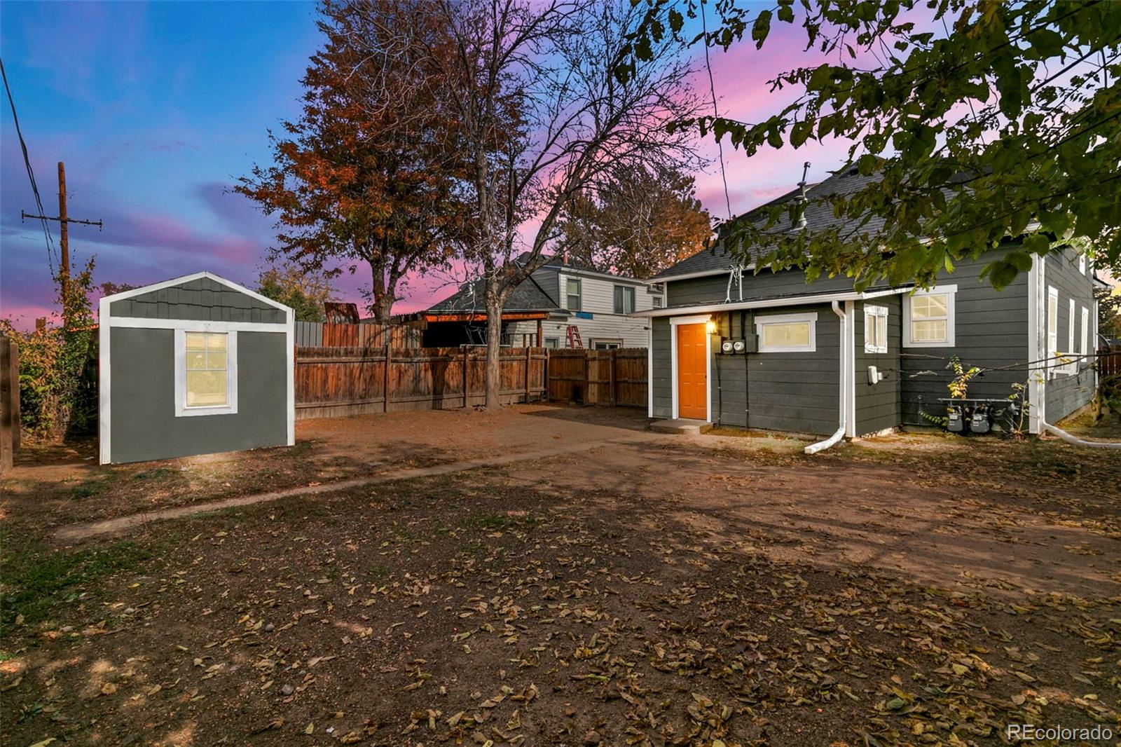 1141 Dayton Street Aurora, CO 80010 - Photo 20 of 23 a front view of a house with a yard