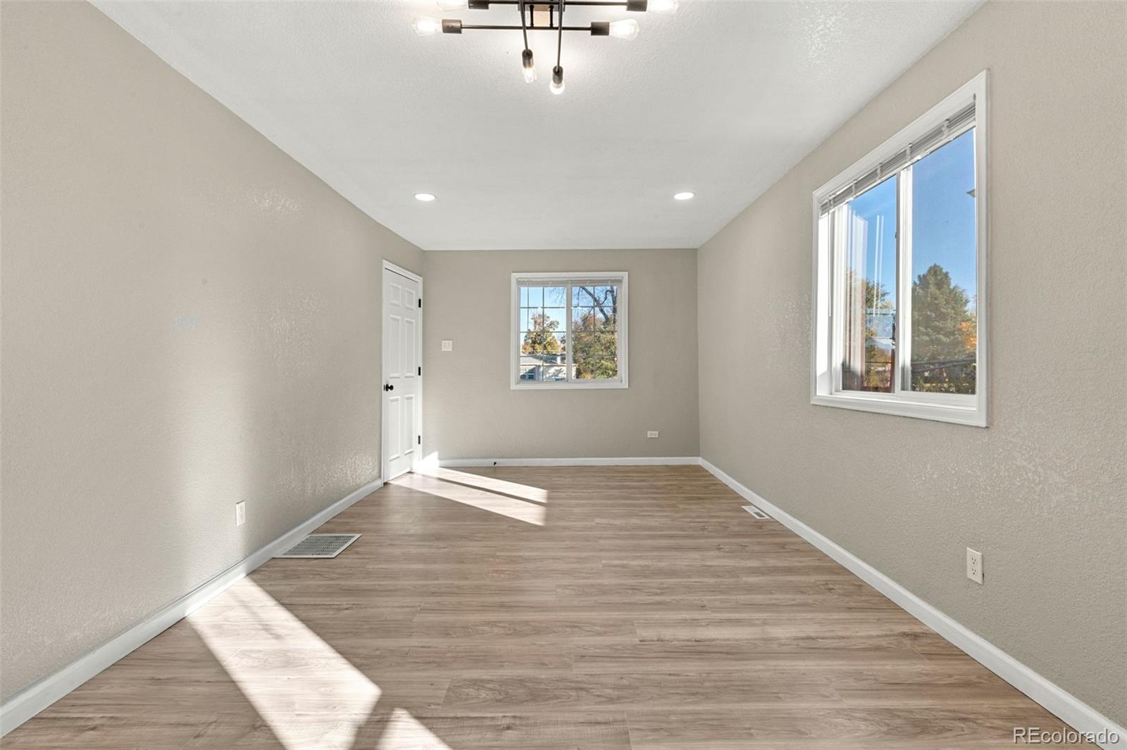 1141 Dayton Street Aurora, CO 80010 - Photo 5 of 23 a view of an empty room with a window