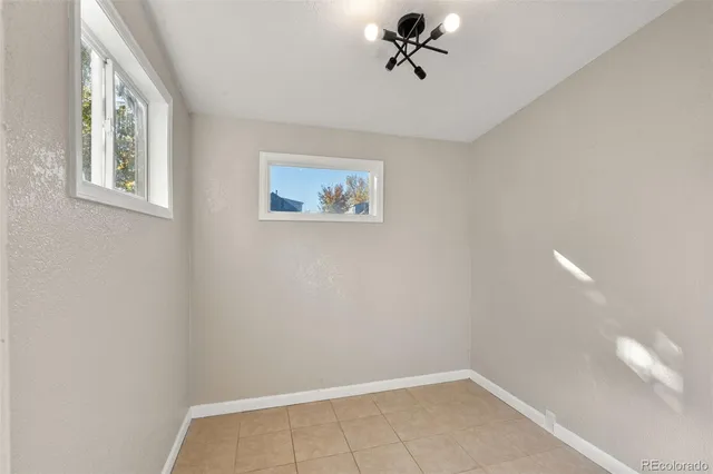 a view of room with window and ceiling fan