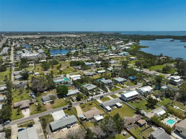 an aerial view of a city with ocean view